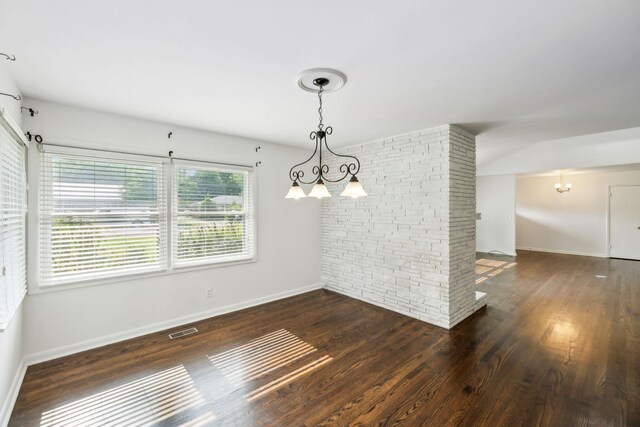 1306 Maymont Dr, Murfreesboro, TN 37130 - unfurnished dining area with a chandelier, wood finished floors, and baseboards