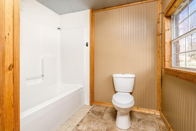 6720 Parker Rd, Lyles, TN 37098 - full bathroom with toilet, bathing tub / shower combination, and wooden walls