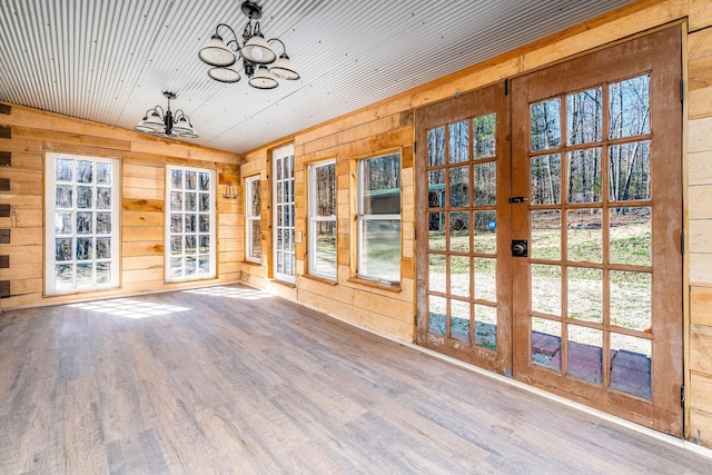 6720 Parker Rd, Lyles, TN 37098 - unfurnished sunroom with french doors, wooden walls, vaulted ceiling, a chandelier, and wood finished floors
