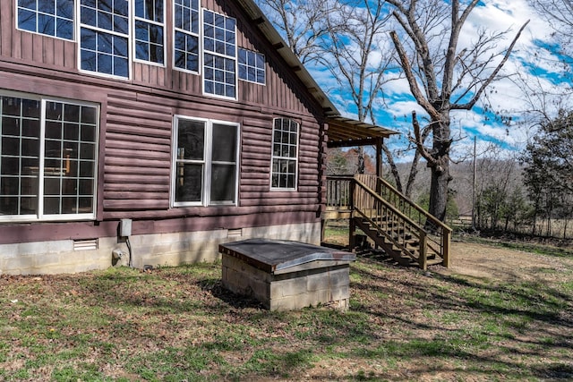 6720 Parker Rd, Lyles, TN 37098 - view of side of property with board and batten siding, crawl space, and a lawn