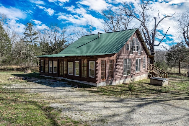 6720 Parker Rd, Lyles, TN 37098 - view of side of home with metal roof and log siding