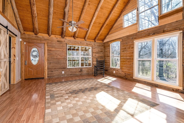 6720 Parker Rd, Lyles, TN 37098 - entryway with wooden ceiling with exposed beams, wood finished floors, a barn door, high vaulted ceiling, and healthy amount of natural light
