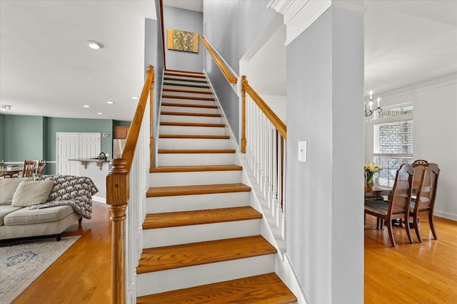 4055 Williford Way, Spring Hill, TN 37174 - staircase featuring wood finished floors, a chandelier, recessed lighting, and ornamental molding