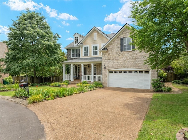 4055 Williford Way, Spring Hill, TN 37174 - view of front of home featuring covered porch, brick siding, driveway, and a garage