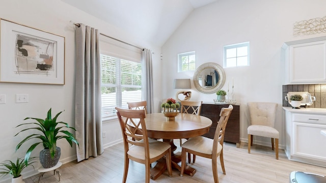 3632 Stormy Ln, Rockvale, TN 37153 - dining room with light wood-type flooring, baseboards, and high vaulted ceiling