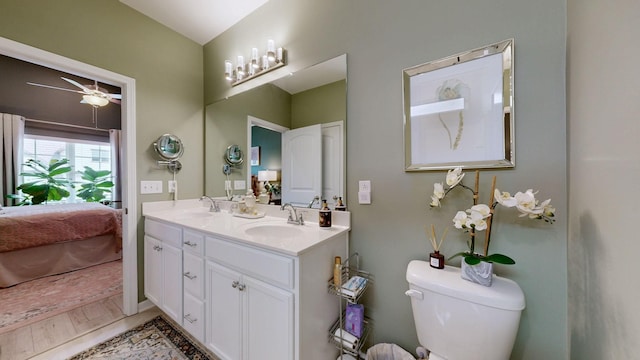 3632 Stormy Ln, Rockvale, TN 37153 - bathroom featuring double vanity, ensuite bath, toilet, a ceiling fan, and wood finished floors