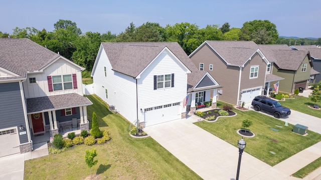 3632 Stormy Ln, Rockvale, TN 37153 - view of front facade featuring covered porch, an attached garage, stone siding, and driveway