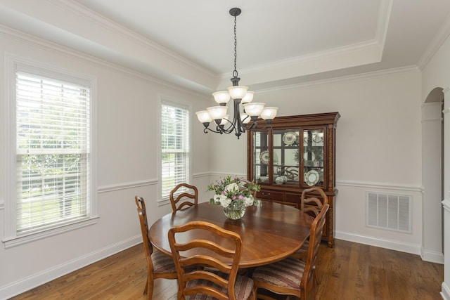 1414 Bernard Way, Franklin, TN 37067 - dining space featuring a chandelier, wood finished floors, arched walkways, baseboards, and crown molding