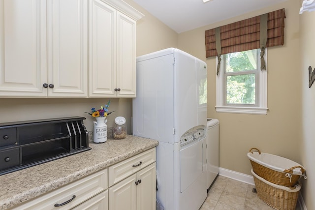 1414 Bernard Way, Franklin, TN 37067 - laundry room with cabinet space, washer / clothes dryer, baseboards, and light tile patterned floors