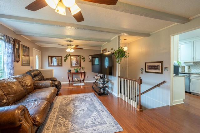 711 Hurricane Hill Dr, Waynesboro, TN 38485 - living room featuring ceiling fan, beam ceiling, wood finished floors, baseboards, and a textured ceiling