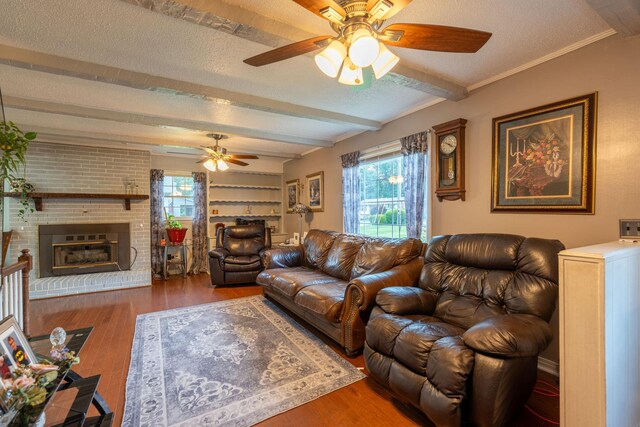711 Hurricane Hill Dr, Waynesboro, TN 38485 - living area featuring ceiling fan, a textured ceiling, healthy amount of natural light, beamed ceiling, and wood finished floors