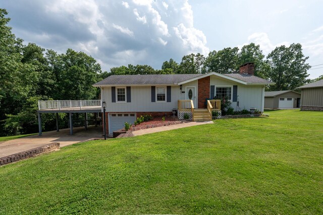 711 Hurricane Hill Dr, Waynesboro, TN 38485 - ranch-style house with concrete driveway, a garage, a chimney, a wooden deck, and a front lawn