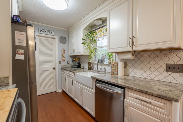 711 Hurricane Hill Dr, Waynesboro, TN 38485 - kitchen with dishwasher, a sink, decorative backsplash, ornamental molding, and wood finished floors