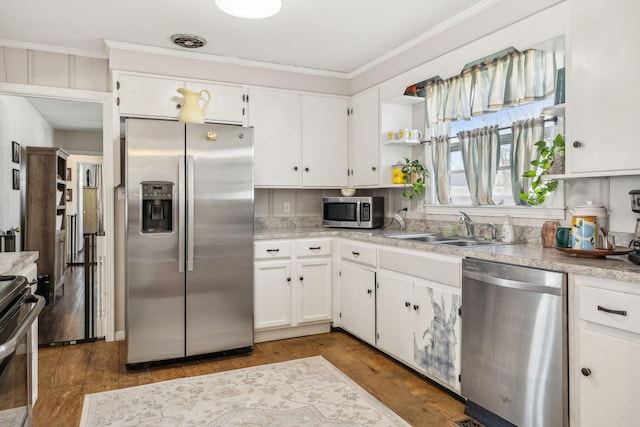 214 Glenn Ave, Gallatin, TN 37066 - kitchen featuring stainless steel appliances, a sink, white cabinetry, crown molding, and light countertops