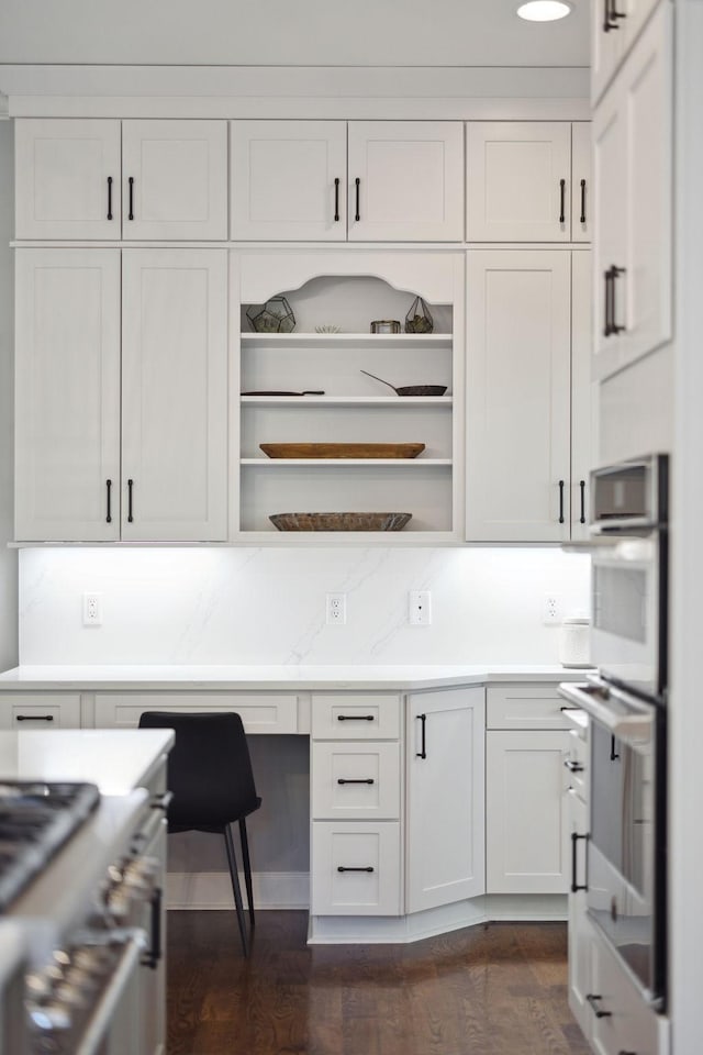 6795 Leipers Creek Rd, Columbia, TN 38401 - kitchen featuring open shelves, dark wood-style flooring, appliances with stainless steel finishes, light countertops, and white cabinets