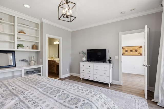 6795 Leipers Creek Rd, Columbia, TN 38401 - bedroom with wood finished floors, a chandelier, crown molding, baseboards, and ensuite bathroom