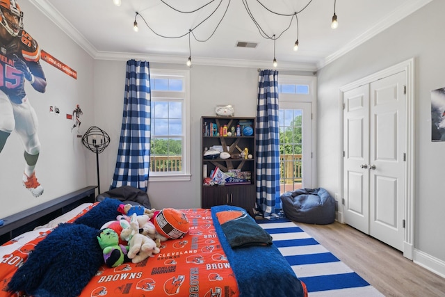 6795 Leipers Creek Rd, Columbia, TN 38401 - bedroom featuring ornamental molding, wood finished floors, access to exterior, and multiple windows