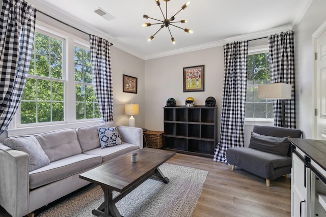 6795 Leipers Creek Rd, Columbia, TN 38401 - living room featuring plenty of natural light, a chandelier, light wood finished floors, and crown molding