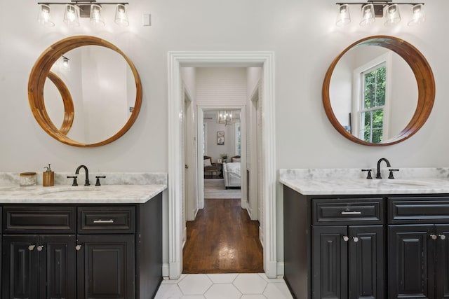 6795 Leipers Creek Rd, Columbia, TN 38401 - ensuite bathroom with two vanities and a chandelier