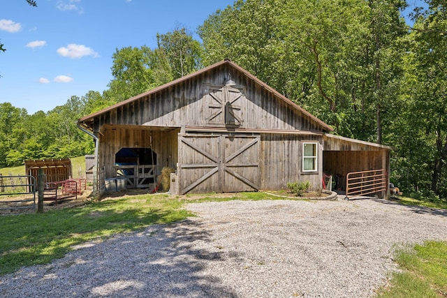 6795 Leipers Creek Rd, Columbia, TN 38401 - view of barn with an exterior structure and a wooded view