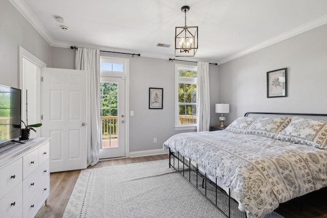 6795 Leipers Creek Rd, Columbia, TN 38401 - bedroom featuring crown molding, access to exterior, light wood-style floors, a chandelier, and baseboards