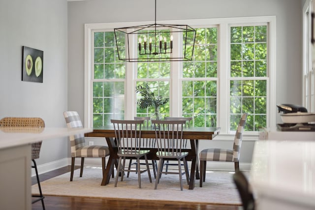 6795 Leipers Creek Rd, Columbia, TN 38401 - dining area with baseboards, a chandelier, and wood finished floors