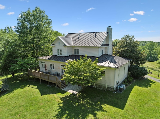 6795 Leipers Creek Rd, Columbia, TN 38401 - back of house featuring a standing seam roof, metal roof, a deck, a yard, and a chimney
