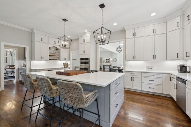 6795 Leipers Creek Rd, Columbia, TN 38401 - kitchen with a chandelier, open shelves, white cabinets, a kitchen island, and a kitchen bar