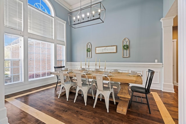 842 Shun Pike, Cottontown, TN 37048 - dining area with a high ceiling, healthy amount of natural light, crown molding, dark wood-style flooring, and a chandelier