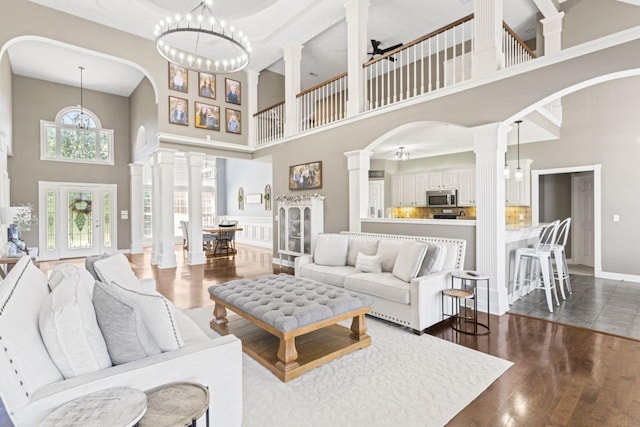 842 Shun Pike, Cottontown, TN 37048 - living area with a high ceiling, arched walkways, wood finished floors, and ornate columns