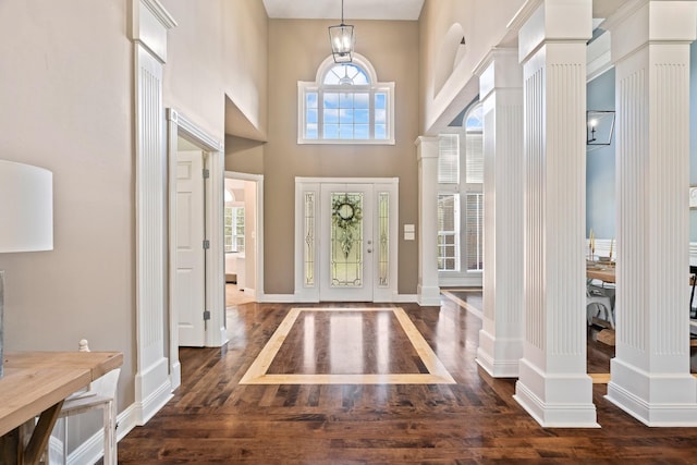 842 Shun Pike, Cottontown, TN 37048 - foyer entrance featuring dark wood-type flooring, decorative columns, healthy amount of natural light, a towering ceiling, and baseboards
