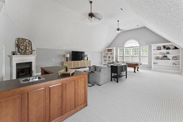 842 Shun Pike, Cottontown, TN 37048 - living area with light colored carpet, a textured ceiling, vaulted ceiling, built in shelves, and pool table
