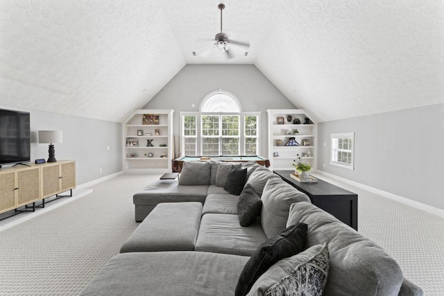 842 Shun Pike, Cottontown, TN 37048 - carpeted living area featuring a textured ceiling, ceiling fan, baseboards, plenty of natural light, and vaulted ceiling