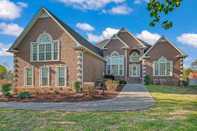 842 Shun Pike, Cottontown, TN 37048 - colonial inspired home with brick siding and a front yard