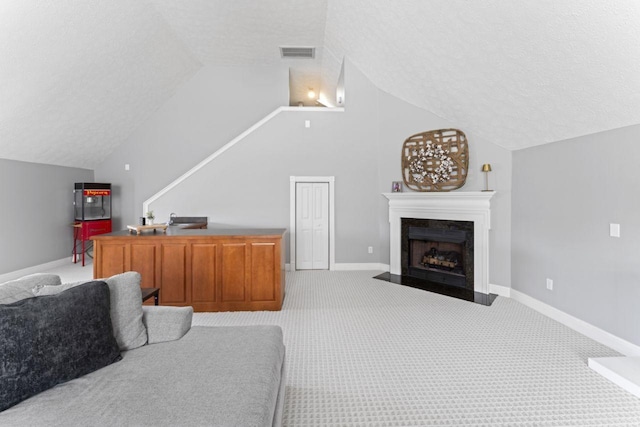 842 Shun Pike, Cottontown, TN 37048 - living area with lofted ceiling, carpet, a fireplace with flush hearth, a textured ceiling, and baseboards