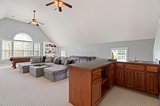 842 Shun Pike, Cottontown, TN 37048 - kitchen featuring light carpet, lofted ceiling, billiards table, stainless steel microwave, and ceiling fan