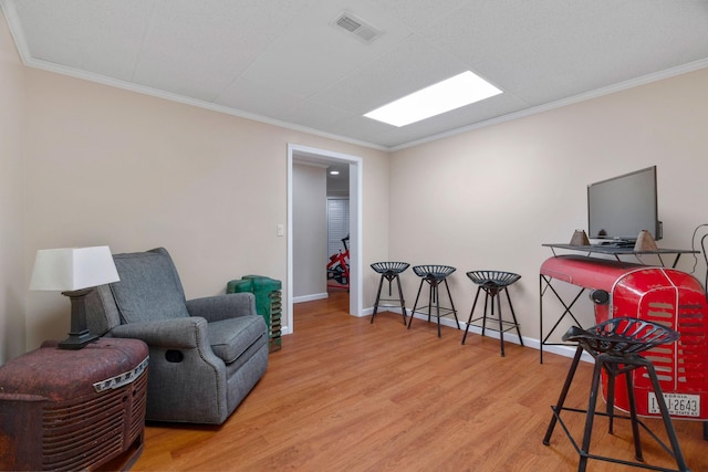 842 Shun Pike, Cottontown, TN 37048 - living area featuring wood finished floors, crown molding, and baseboards