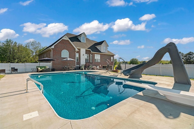 842 Shun Pike, Cottontown, TN 37048 - view of pool featuring a water slide, a patio, and a fenced backyard