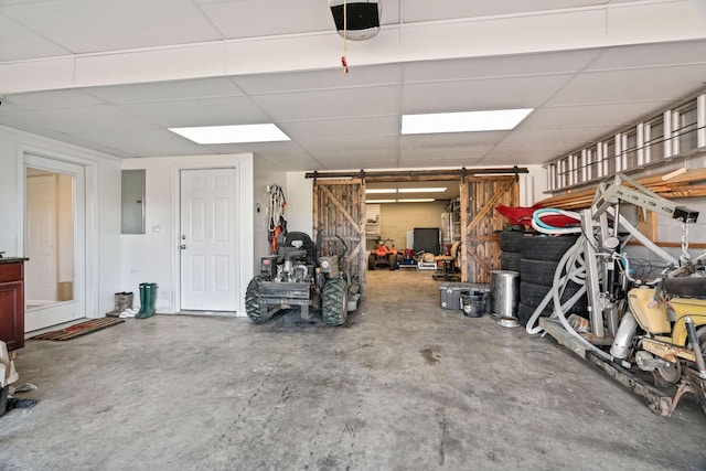 842 Shun Pike, Cottontown, TN 37048 - garage with electric panel and a garage door opener
