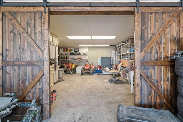 842 Shun Pike, Cottontown, TN 37048 - garage with concrete block wall and gas water heater