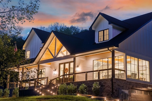 407 Hogans Branch Rd, Goodlettsville, TN 37072 - rear view of house featuring board and batten siding, a garage, and french doors