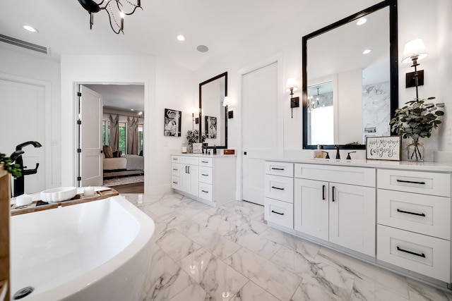 407 Hogans Branch Rd, Goodlettsville, TN 37072 - bathroom with a soaking tub, two vanities, ensuite bathroom, marble finish flooring, and recessed lighting
