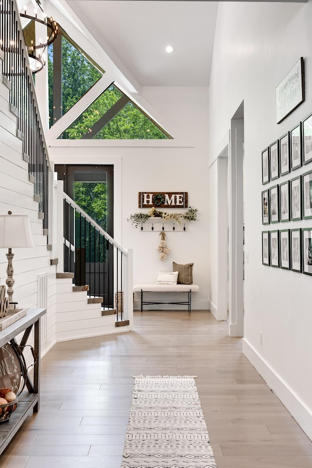 407 Hogans Branch Rd, Goodlettsville, TN 37072 - foyer featuring stairway, a towering ceiling, wood finished floors, a chandelier, and baseboards