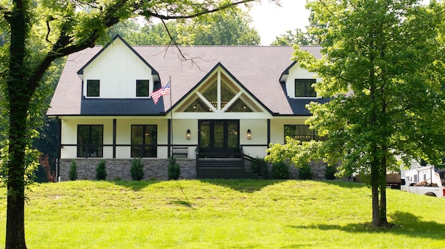 407 Hogans Branch Rd, Goodlettsville, TN 37072 - modern farmhouse style home featuring covered porch, french doors, a front lawn, roof with shingles, and board and batten siding