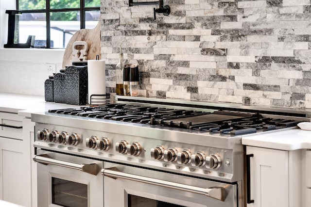 407 Hogans Branch Rd, Goodlettsville, TN 37072 - kitchen with double oven range, tasteful backsplash, and light countertops
