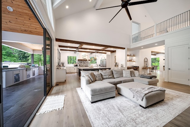 407 Hogans Branch Rd, Goodlettsville, TN 37072 - living area with beam ceiling, high vaulted ceiling, a ceiling fan, light wood-type flooring, and recessed lighting