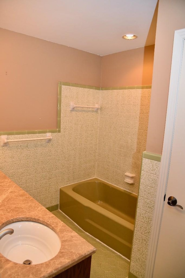 1314 Burton Valley Rd, Nashville, TN 37215 - bathroom featuring tile walls, double vanity, and a wainscoted wall