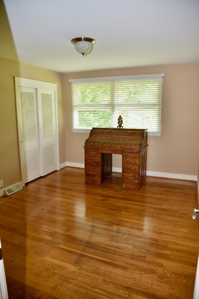 1314 Burton Valley Rd, Nashville, TN 37215 - unfurnished living room with wood finished floors and baseboards