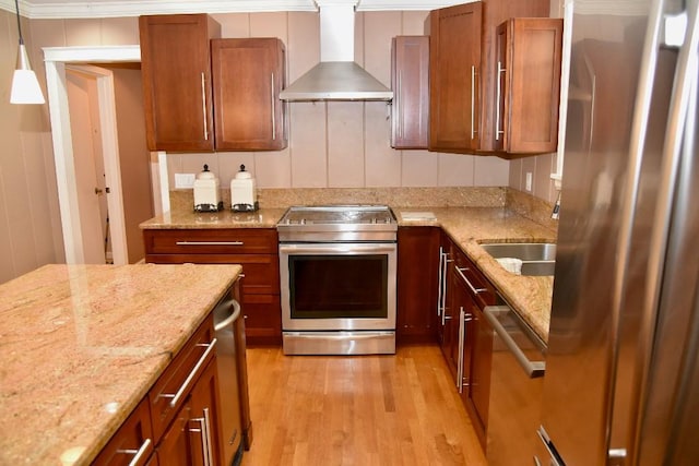 1314 Burton Valley Rd, Nashville, TN 37215 - kitchen featuring wall chimney range hood, stainless steel appliances, light wood-type flooring, and brown cabinets