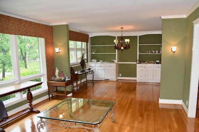 1314 Burton Valley Rd, Nashville, TN 37215 - living room with ornamental molding, a chandelier, wood finished floors, and baseboards